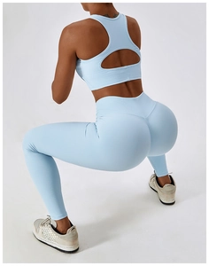 Detail of light blue ribbed sports bra featuring a hollow-out back and V-shaped seam design
