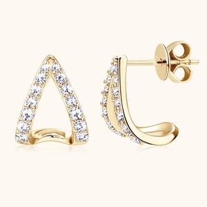 Close-up of golden S925 sterling silver earrings with triangular moissanite insets