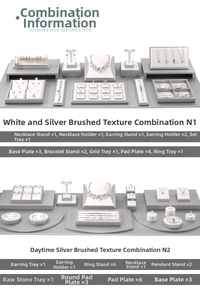 Detailed view of white leather jewelry display sets including necklace and ring organizers