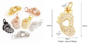 Detailed macro view showing dimensions and four colors of micro-pave foot shaped pendants