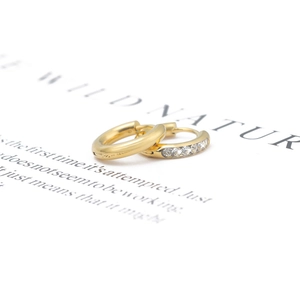 Pair of gold stainless steel hoop earrings with micro-inlaid cubic zirconia accents