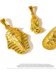 Detailed view of gold Egyptian Pharaoh and praying hand stainless steel pendants