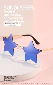 Detail of star-shaped rimless sunglasses with blue lenses and gold metal temples