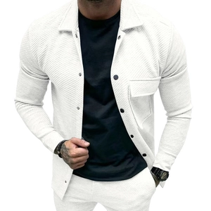 Close-up of white heavy twill jacket texture with contrast black buttons and flap pocket