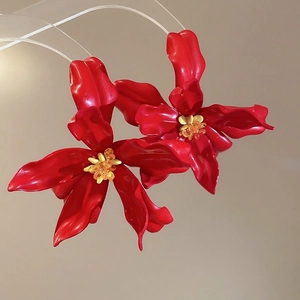 Chic red acrylic flower earrings with glossy petals and yellow beaded stamen details