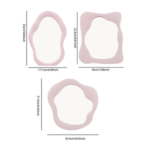 Three irregular cloud-shaped pink makeup mirrors with dimension measurements on white background
