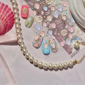 Marine theme nail art stickers featuring 3D shells, starfish and metallic gold accents