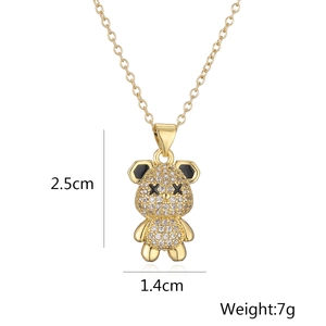 Detailed view of gold bear pendant dimensions 2.5cm by 1.4cm with crystal accents