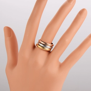 Three-piece stainless steel ring set in gold, silver, and rose gold with Roman numerals