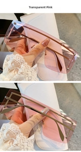 Detail view of pink rimless oversized sunglasses with metal rivets and slim temples