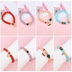Set of 4 colorful glass beaded bracelets with cute metal charms and peach pendants