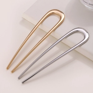 Minimalist U-shaped metal hair pins in gold and silver finish for sleek bun styling