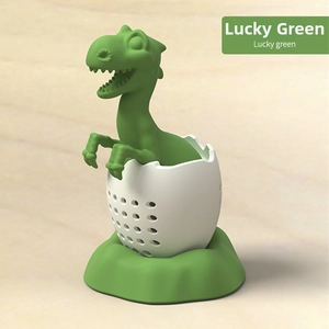 Detail of green dinosaur tea infuser with lucky green color and small filter holes
