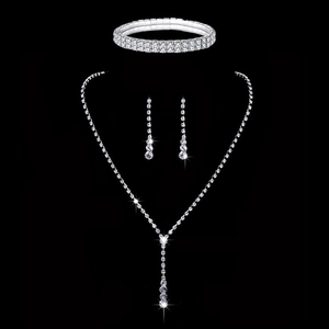 Detailed view of silver bridal jewelry set with V-pendant necklace and sparkly crystals