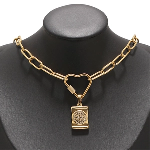 Gold stainless steel thick chain necklace with heart carabiner and square pendant on a bust