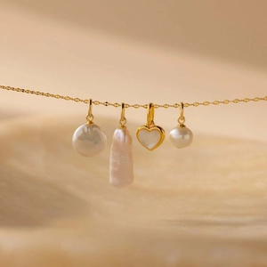 18K gold plated stainless steel necklace with four unique assorted pearl pendants