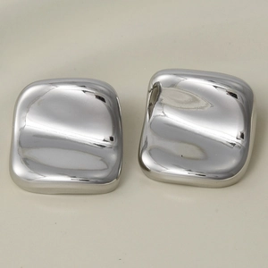 Macro detail of silver geometric square earrings with fluid ripple surface in 304 steel
