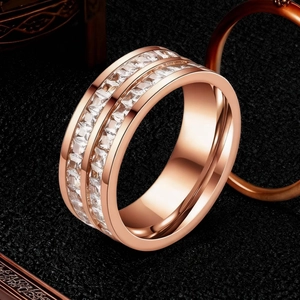 Macro shot of rose gold stainless steel ring with double rows of square zircon stones