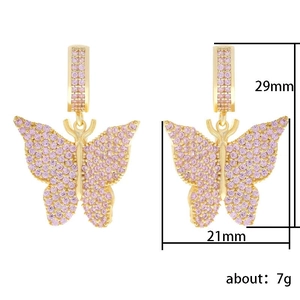Micro-set pink zircon butterfly earrings in gold finish measuring 29mm by 21mm