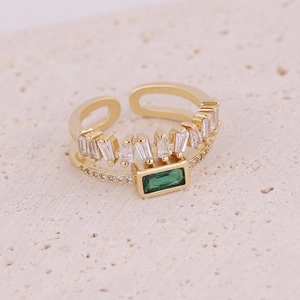 Adjustable gold ring featuring square green gemstone and white baguette zircon accents