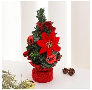 Close-up of a 20cm mini Christmas tree with red bows, flowers, and checkered base