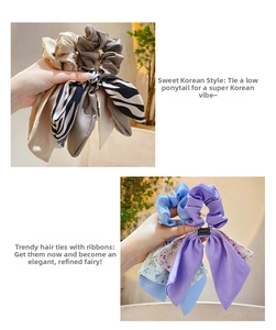 Detail of satin floral bow hair ties in multiple colors like champagne and zebra print