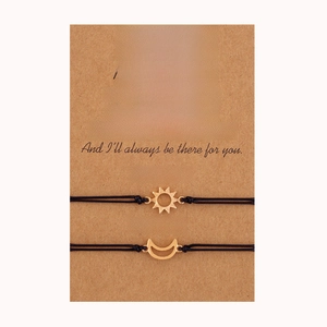 Handmade woven sun and moon charms friendship bracelets on message card