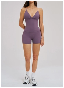 Detail of purple two-piece yoga set with V-neck camisole and high-waist shorts