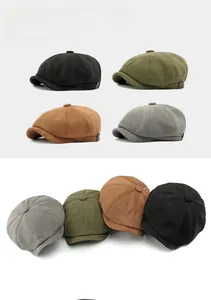 Detalle de gorras newsboy de ante en color negro, verde oliva, marrón y gris