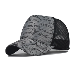 Side view of checkered trucker hat with Eiffel Tower print and breathable black mesh