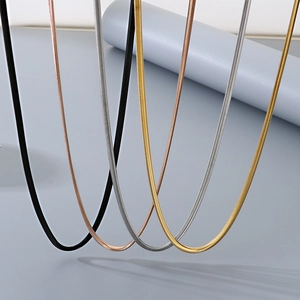 Flat snake chain necklace set in gold, rose gold, silver, and black stainless steel