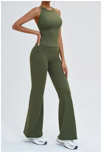 Detail view of ribbed dark green yoga set featuring back hollow vest and high waist pants