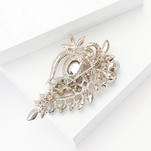 Detailed back view of vintage alloy brooch featuring safe pin clasp and rhinestone setting
