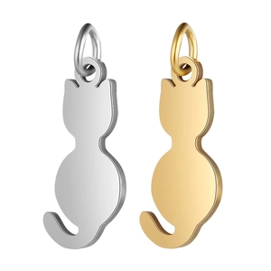 Detailed macro view of cat silhouette charms in polished gold and silver stainless steel