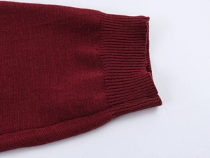 Detailed macro view of the burgundy ribbed knit cuff with high-density stitching