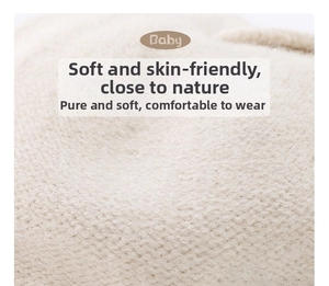 Macro detail of soft beige knit fabric for baby cherry beret showing fiber texture