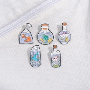 Cute marine life enamel pins set featuring clownfish and sea turtles on a canvas background