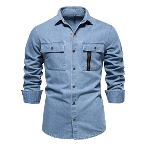 Detail of dark blue denim shirt featuring dual chest pockets and a vertical zipper accent