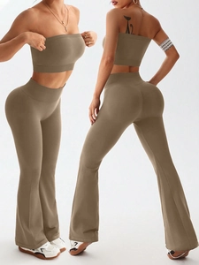 Detail of high-waisted flared yoga pants and bandeau top in seamless ribbed fabric