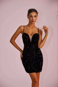 Detailed close-up of shiny black sequins on the plunging V-neckline evening mini dress