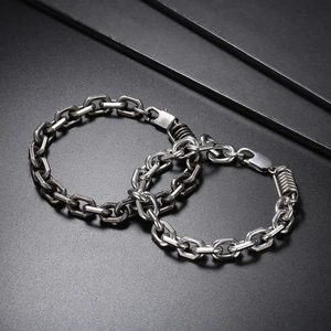Close-up of industrial punk style stainless steel chain bracelets with lobster clasp