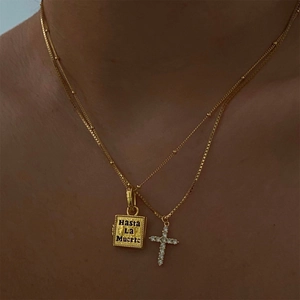Gold double chain necklace featuring Hasta La Muerte plate and zircon cross pendant