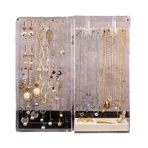 Clear acrylic jewelry organizer box for necklaces and rings with velvet base