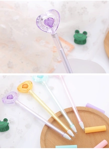 Detail view of colorful crystal heart gel pens in purple, yellow, blue and pink colors