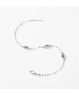 Detail of silver S925 Evil Eye bracelet with blue crystal charms on white background