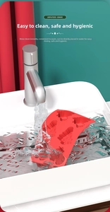 Close-up of food-grade silicone Christmas tree mold being rinsed under running water