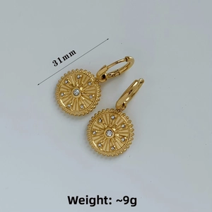 Detail view of gold sunburst drop earrings with cubic zirconia and size dimensions