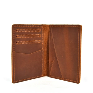 Detail view of the interior card slots and compartments in a brown crazy horse leather wallet