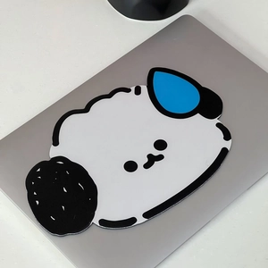 Detail of the cute cartoon dog mouse pad with a textured finish on a laptop surface