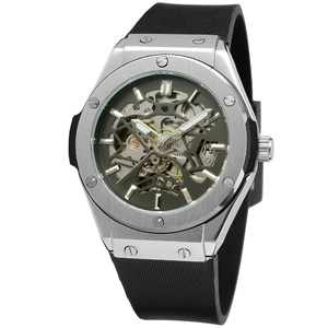 Detailed macro of the silver skeleton watch showing gold movement gears and black rubber strap